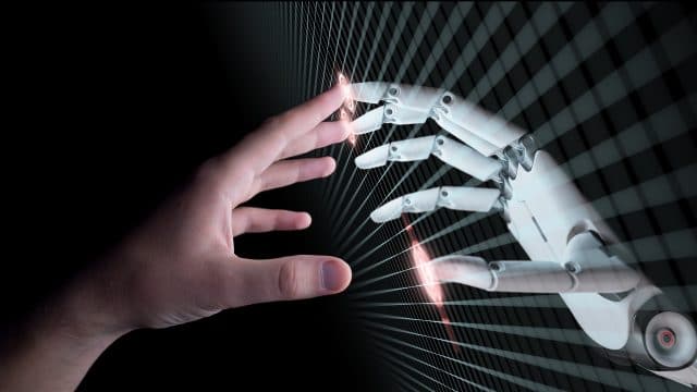 la main d'un robot et d'un humain se touchant